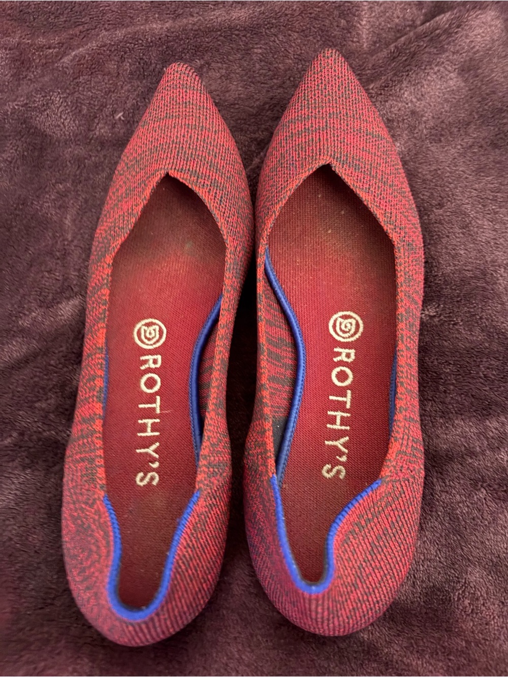 Rothy’s “The point” ballet flats textured knit pattern with royal blue trim.